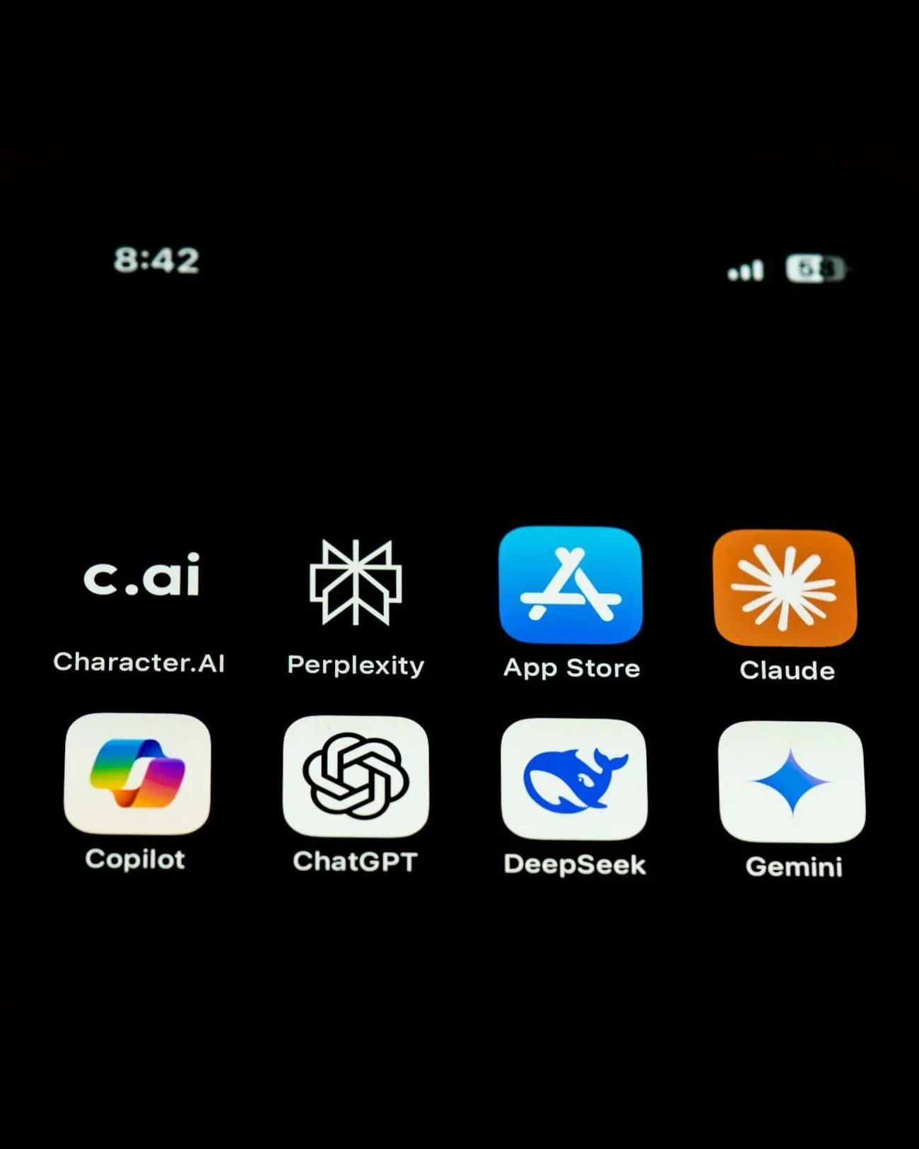 A phone screen with AI apps such as ChatGPT, Gemini, Perplexity and Copilot