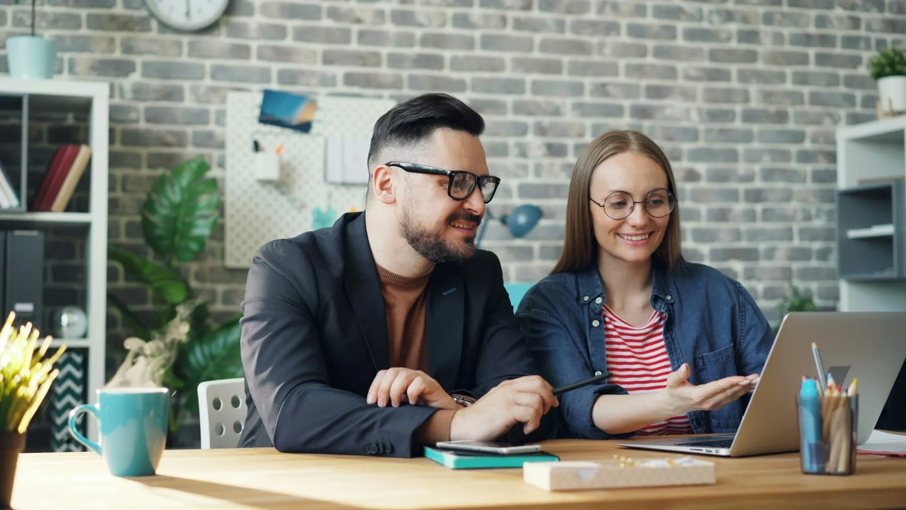 Colleagues talking through a client's search report