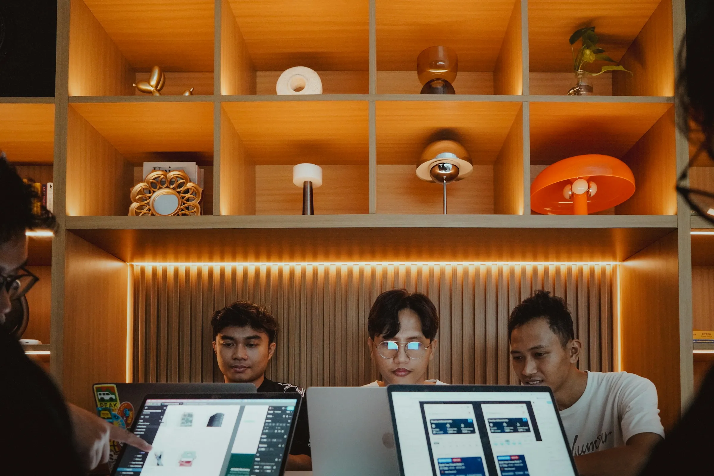 Colleagues working together in a bright studio
