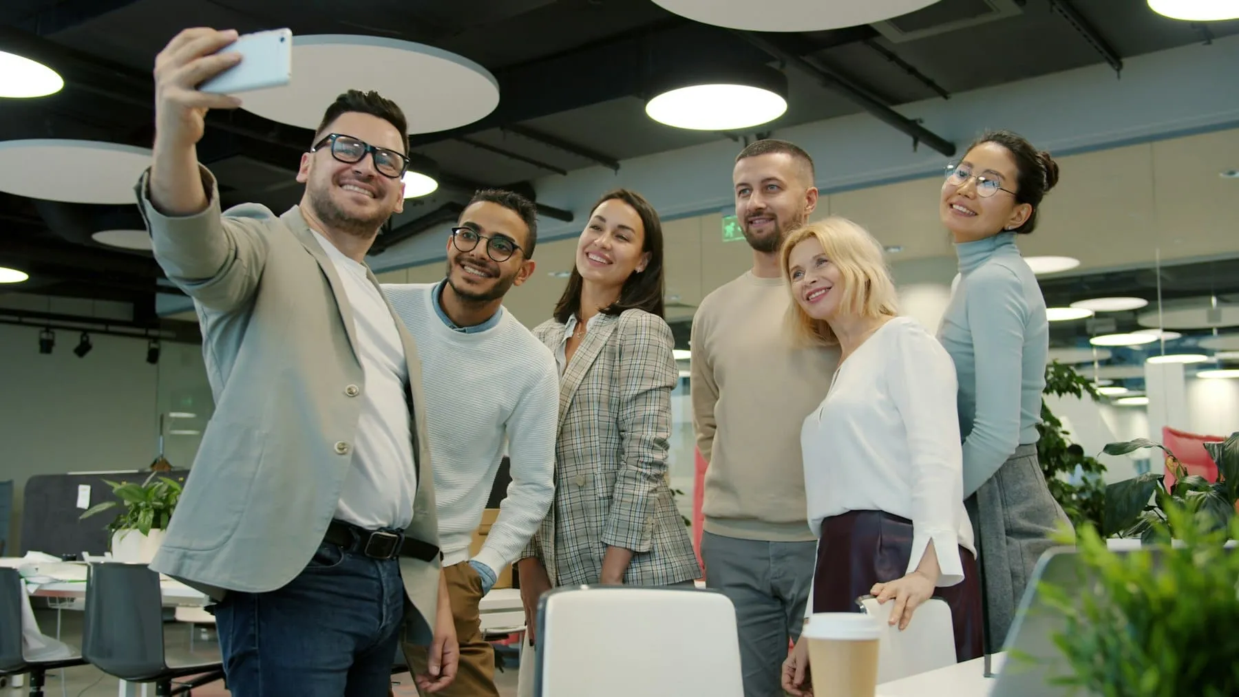 A team celebrating together in a bright office