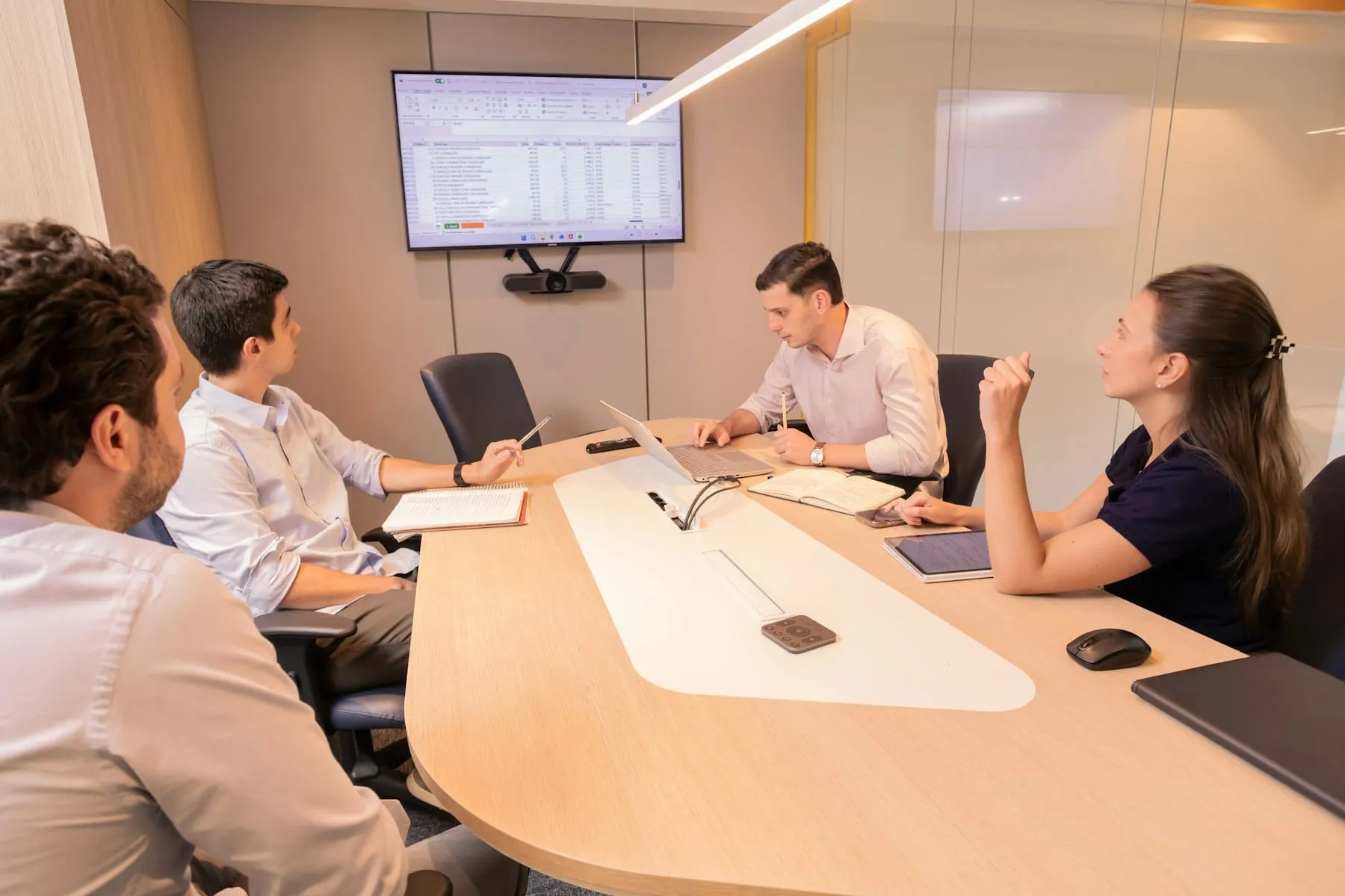 Three colleagues discussing a client project