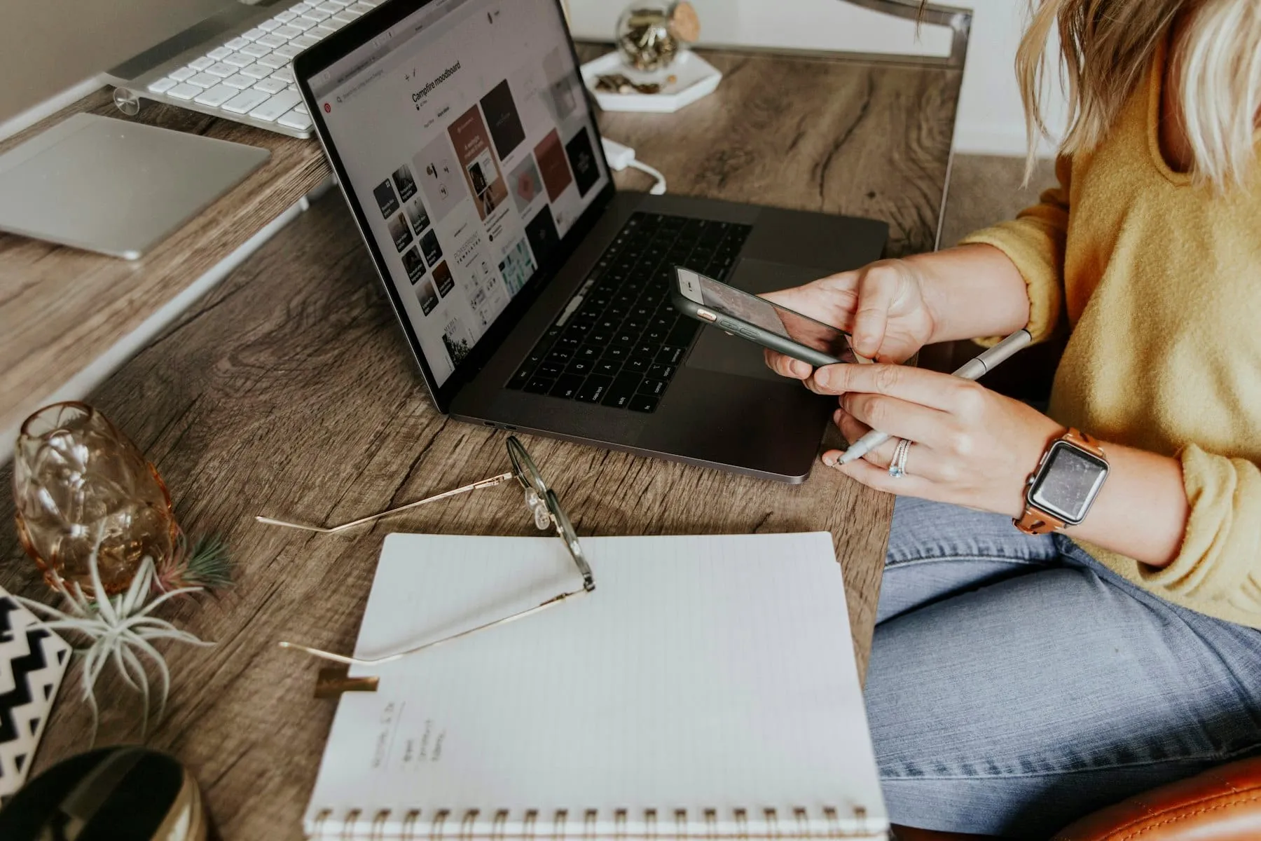 A guest paying for a booking with a card at a laptop