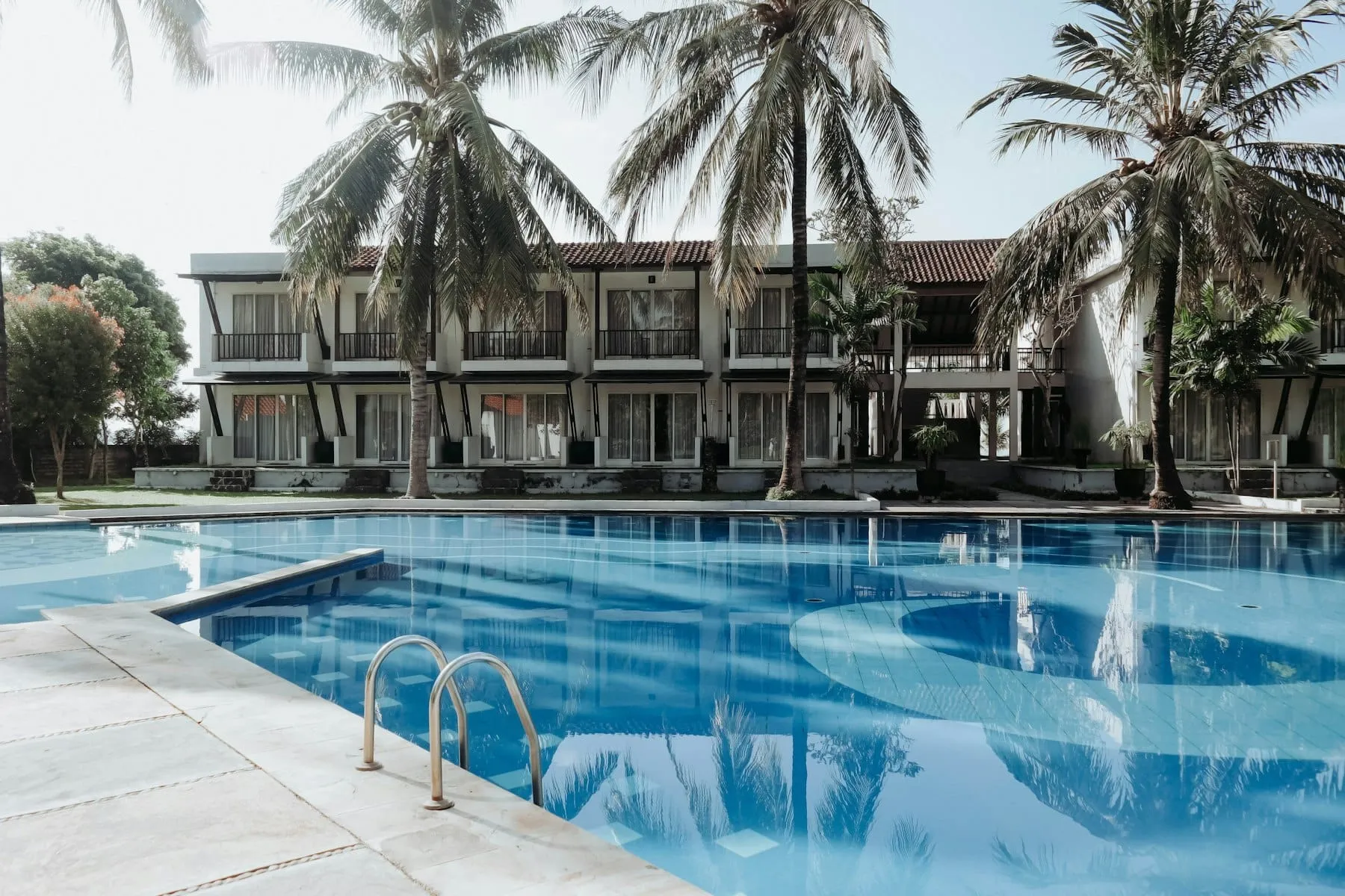 A quiet hotel courtyard with a pool