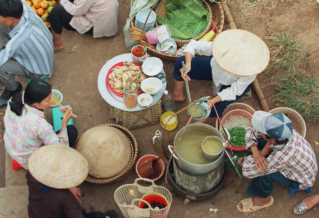 Bun cha vendor showing relationship marketing in Hanoi street food